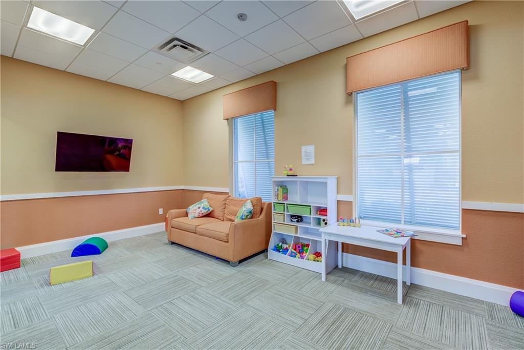 2827 Blossom Way Naples, FL 34120 - Photo 30 of 34 Recreation room with a drop ceiling
