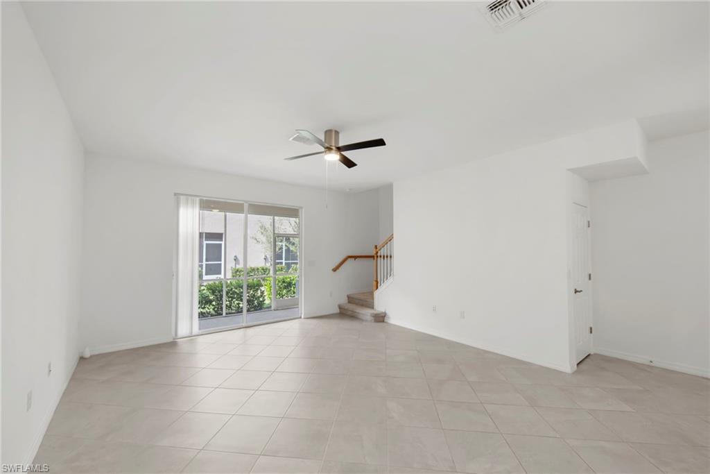 2827 Blossom Way Naples, FL 34120 - Photo 3 of 34 Empty room featuring a ceiling fan and light tile patterned flooring