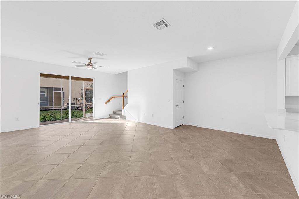 2827 Blossom Way Naples, FL 34120 - Photo 3 of 31 Spare room featuring a ceiling fan and recessed lighting