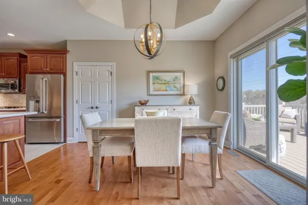 a view of a chairs and table on the deck