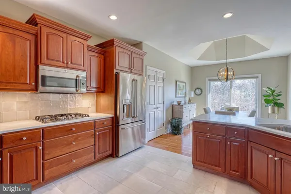 a kitchen with sink and cabinets