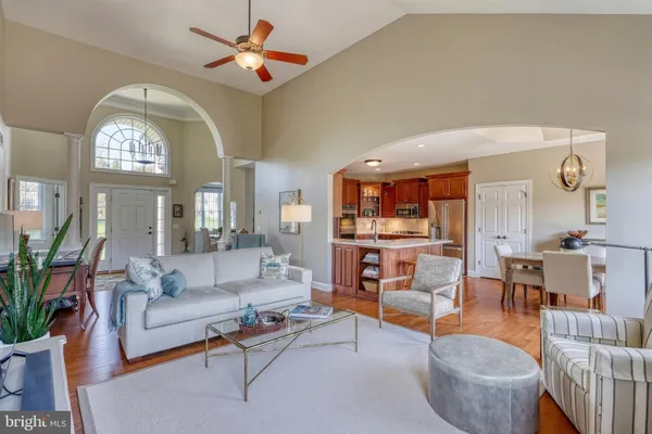a kitchen with kitchen island a stove and a refrigerator