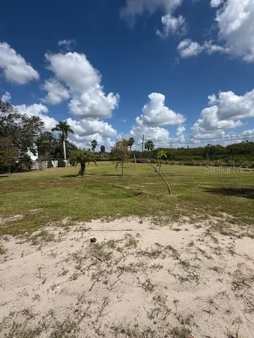 an aerial view of residential building and lake