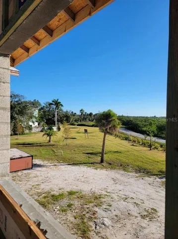 a view of a yard with an outdoor space