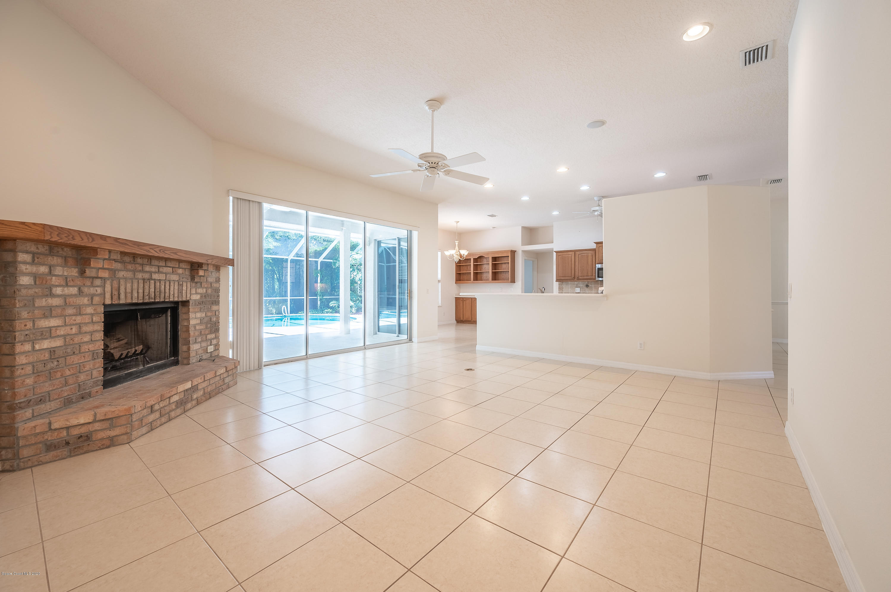 3135 Weber Road Malabar, FL 32950 - Photo 12 of 45 Great Room to Kitchen