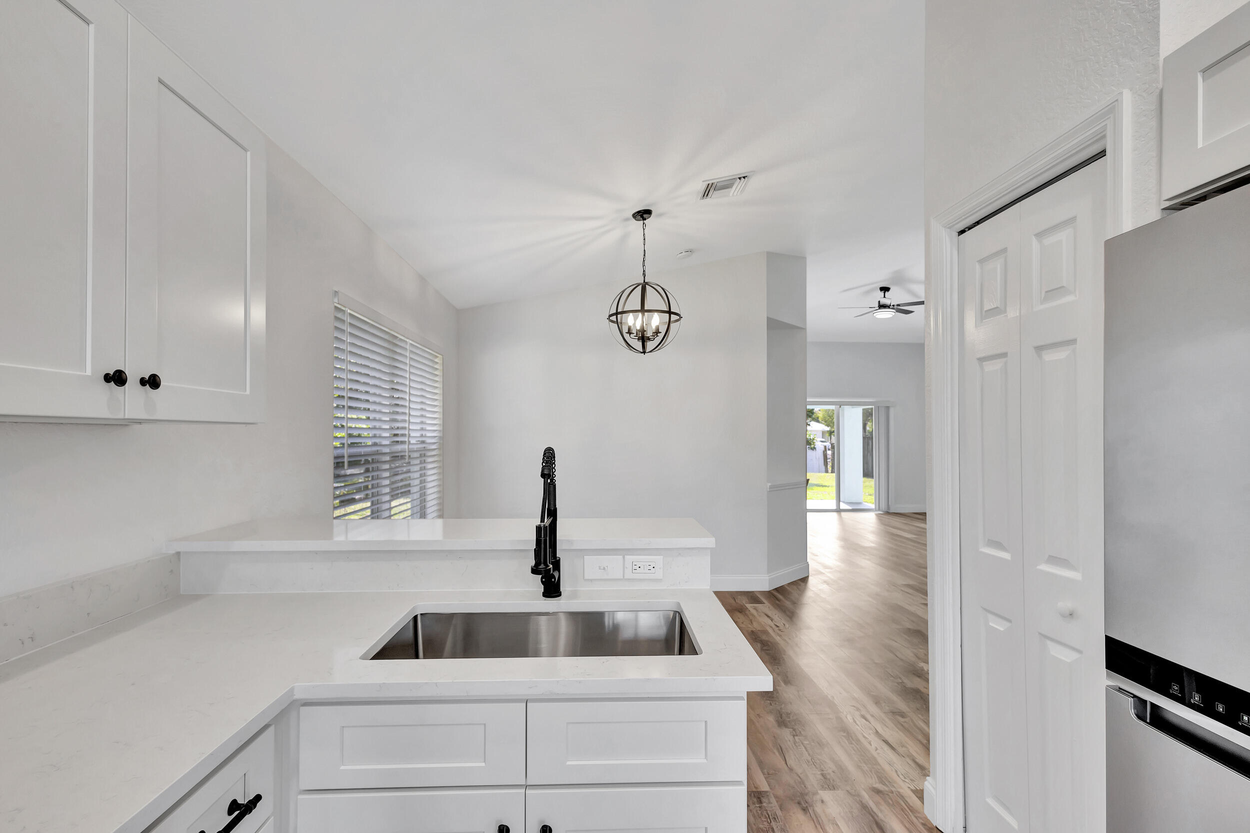 6746 3rd Street Limestone Creek, FL 33458 - Photo 14 of 60 a kitchen with a sink and a window