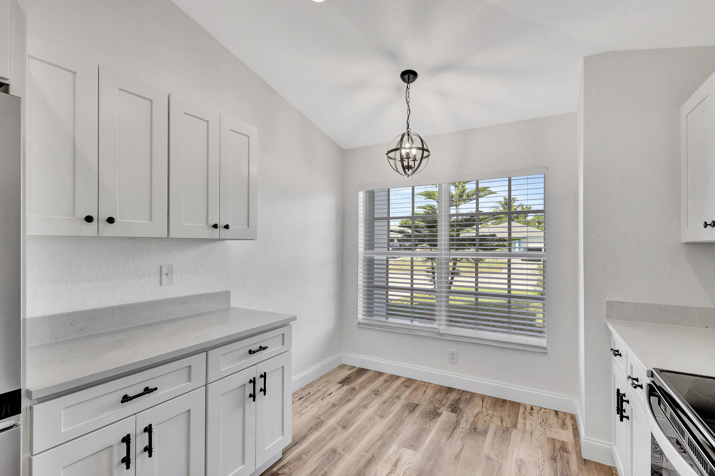 6746 3rd Street Limestone Creek, FL 33458 - Photo 17 of 60 a kitchen that has a lot of windows in it
