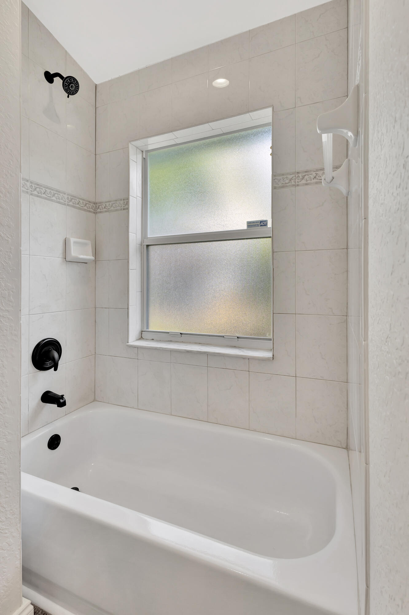 6746 3rd Street Limestone Creek, FL 33458 - Photo 30 of 60 a bathroom with a bathtub