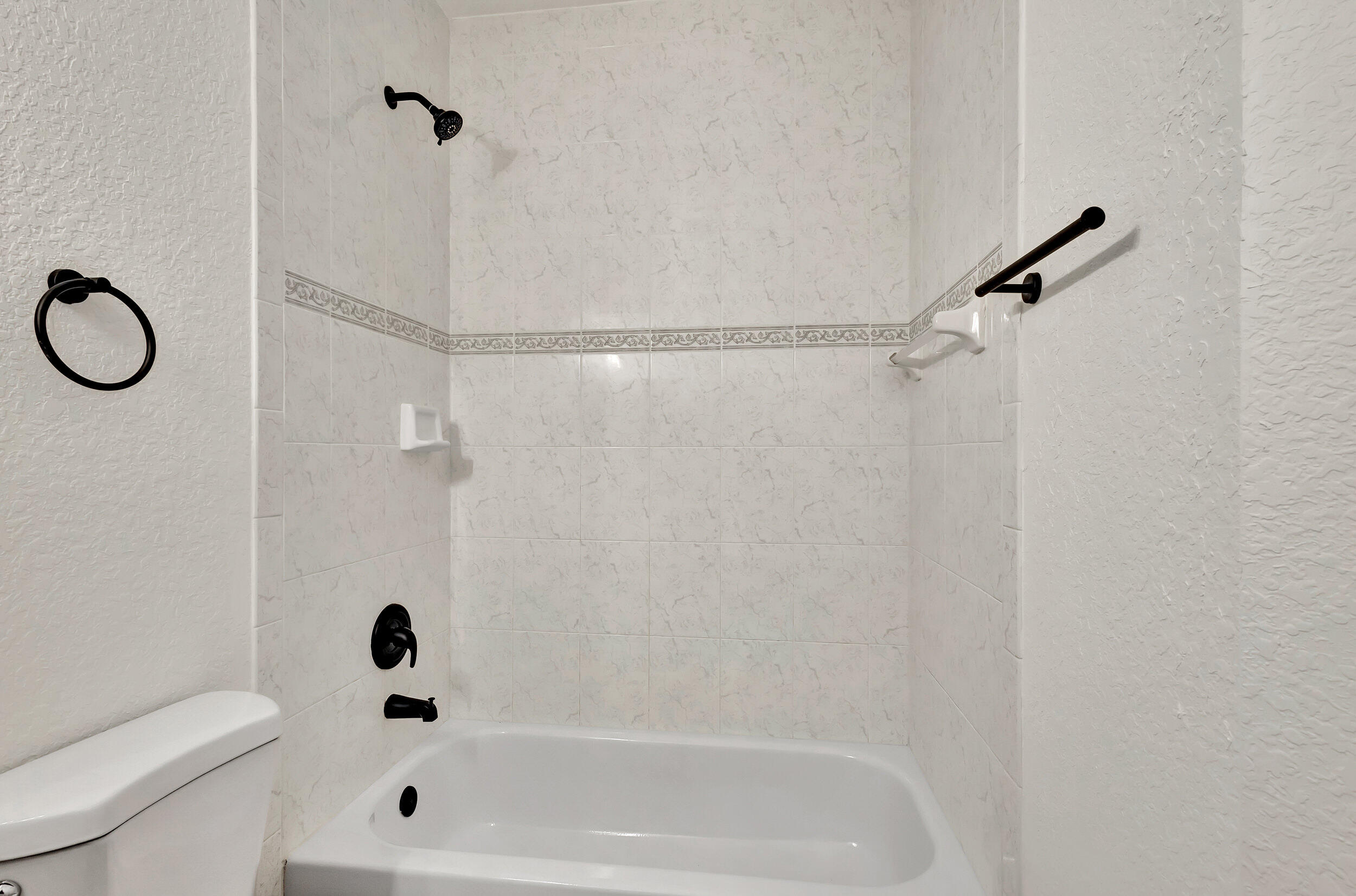 6746 3rd Street Limestone Creek, FL 33458 - Photo 35 of 60 a bathroom with a shower and a toilet