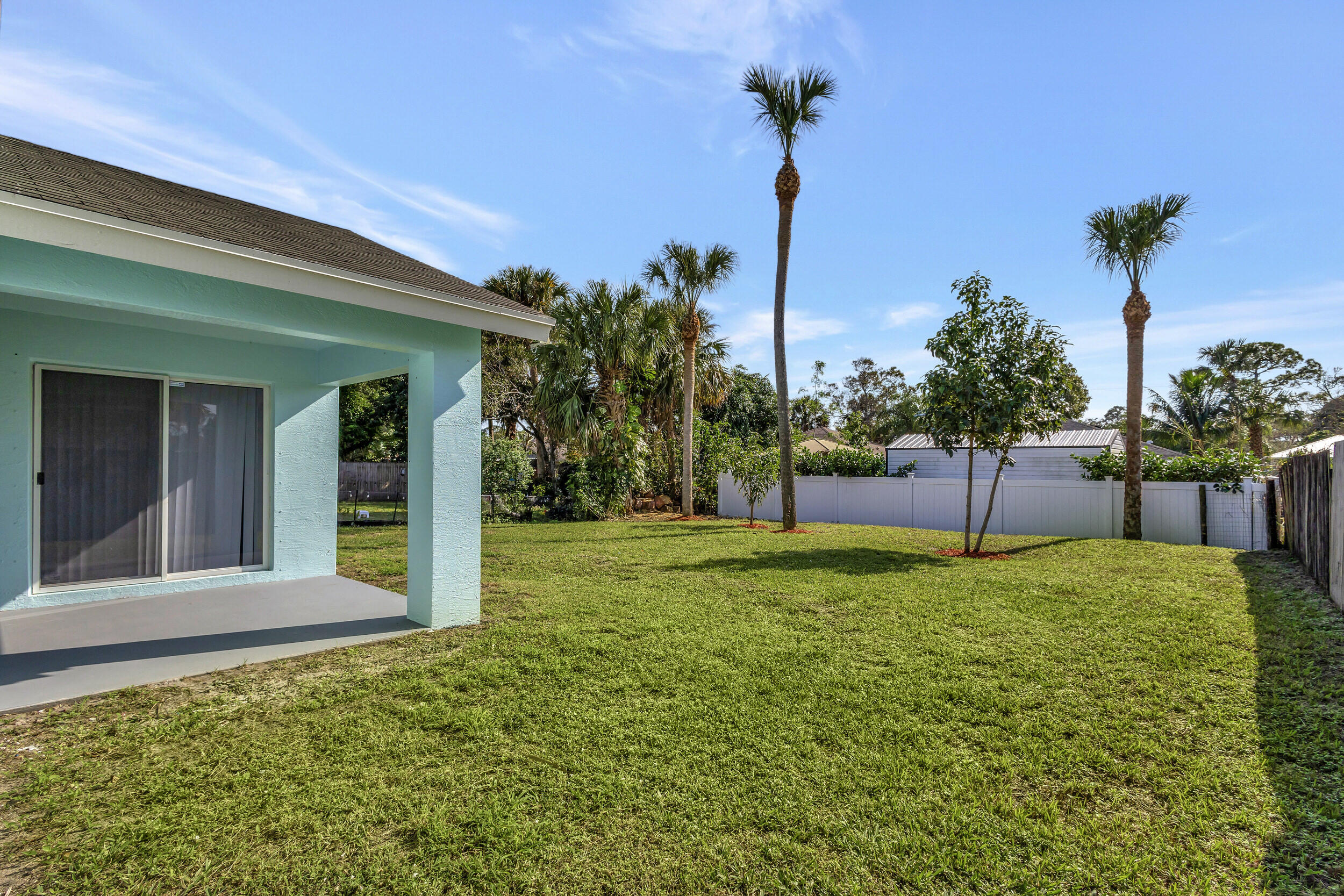 6746 3rd Street Limestone Creek, FL 33458 - Photo 41 of 60 a view of a house with backyard and a tree