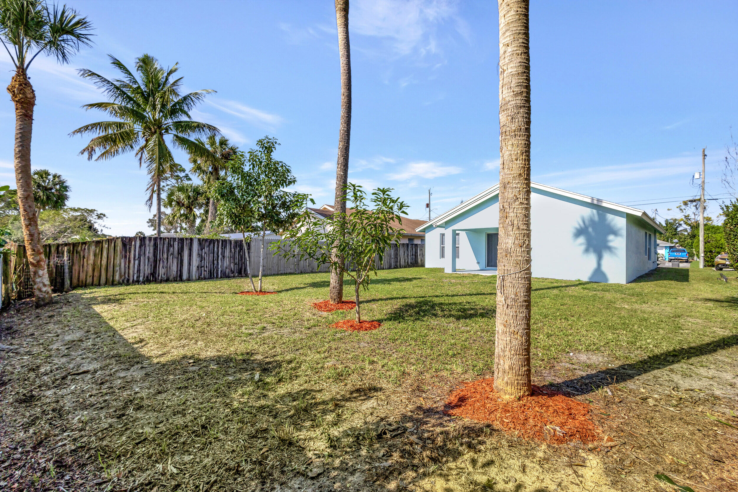 6746 3rd Street Limestone Creek, FL 33458 - Photo 47 of 60 a view of a house with backyard and tree