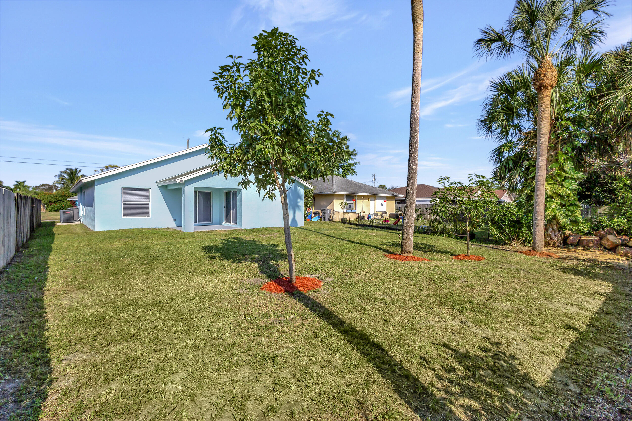 6746 3rd Street Limestone Creek, FL 33458 - Photo 48 of 60 a view of a house with a yard and street