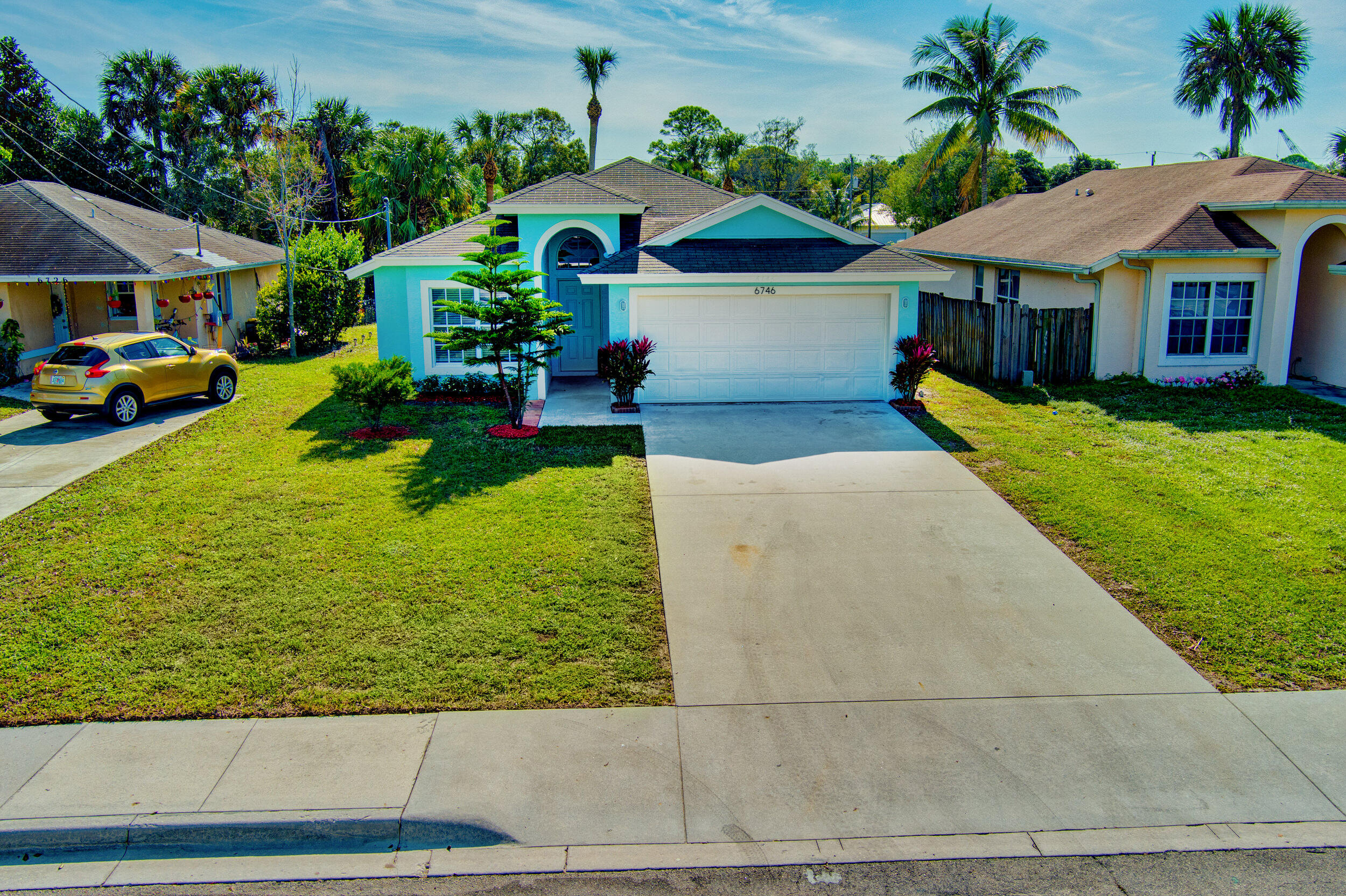 6746 3rd Street Limestone Creek, FL 33458 - Photo 49 of 60 a front view of a house with garden
