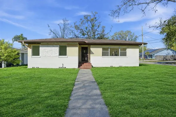front view of a house with a yard