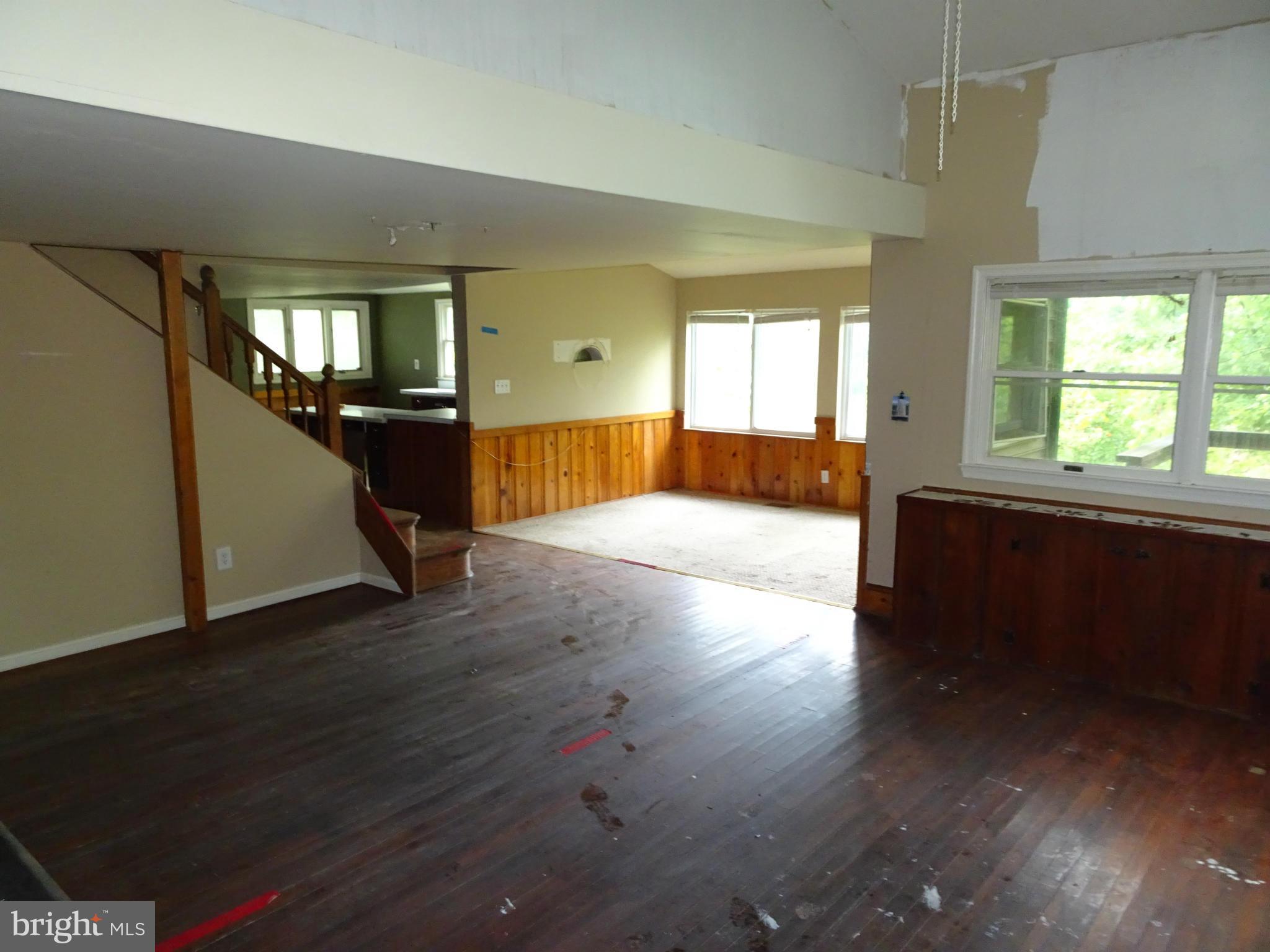 4514 Baptist Road Taneytown, MD 21787 - Photo 6 of 11 an empty room with wooden floor and windows