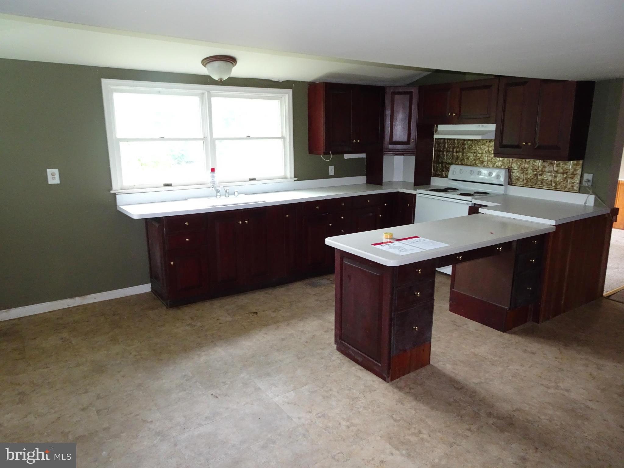 4514 Baptist Road Taneytown, MD 21787 - Photo 8 of 11 a kitchen with a sink and a window