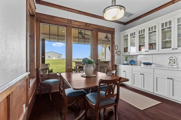 a kitchen with a table and chairs in it