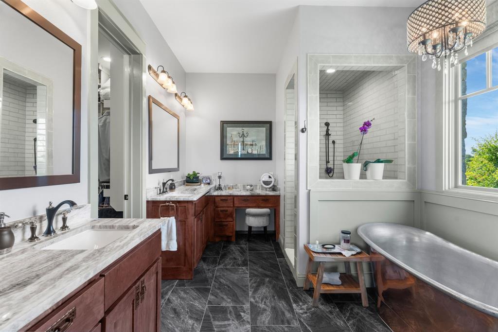 1206 Jc Maples Road Gunter, TX 75058 - Photo 15 of 40 a spacious bathroom with a granite countertop sink a toilet and a mirror