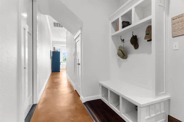 a bathroom with a sink toilet double vanity and shower