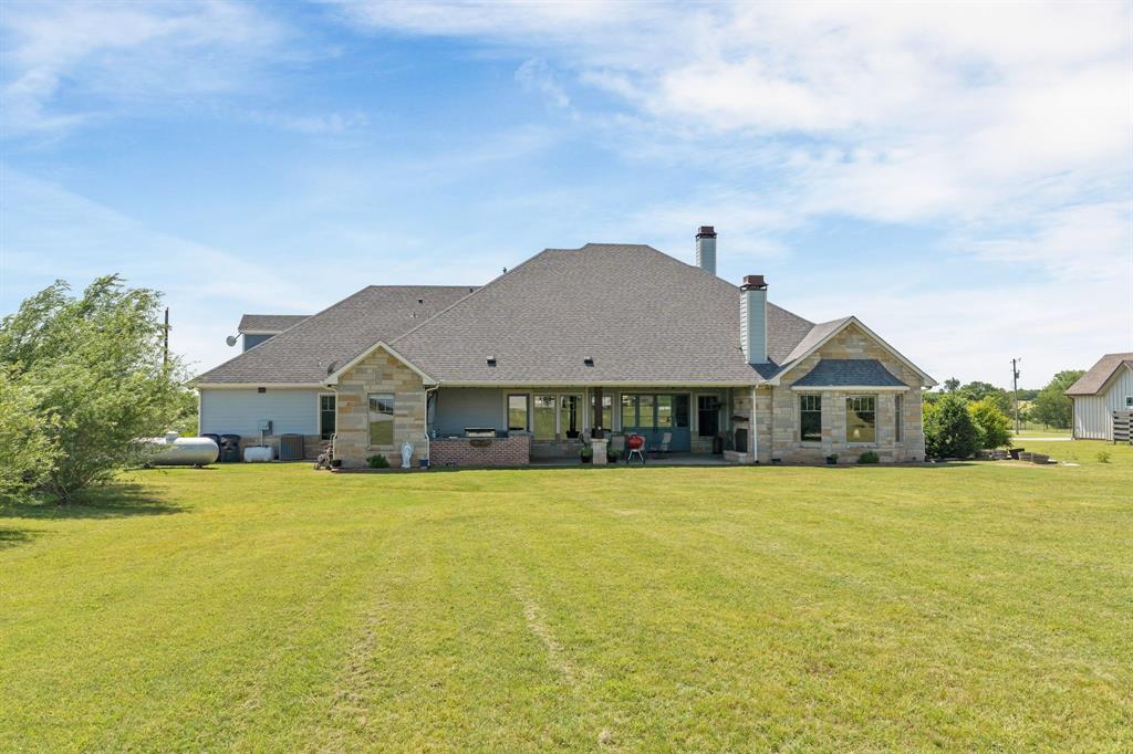 1206 Jc Maples Road Gunter, TX 75058 - Photo 26 of 40 a front view of house with yard and green space
