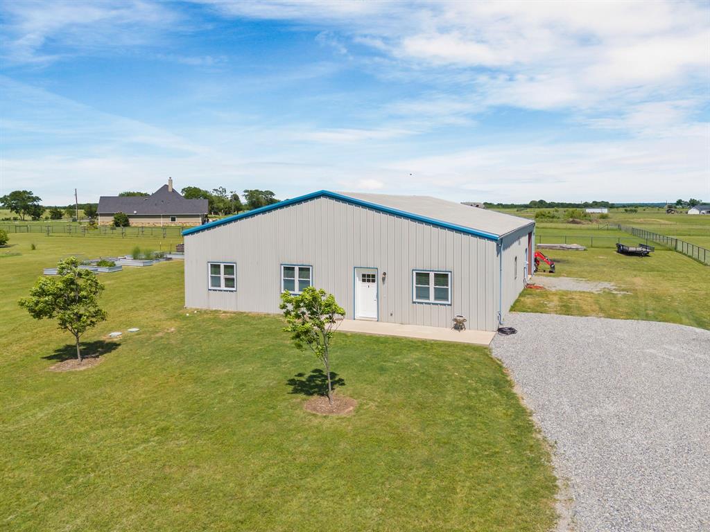 1206 Jc Maples Road Gunter, TX 75058 - Photo 28 of 40 a house view with a garden space