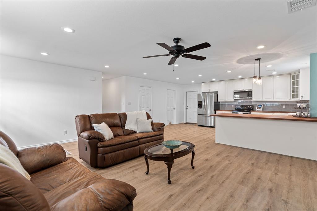 1206 Jc Maples Road Gunter, TX 75058 - Photo 34 of 40 a living room with furniture and a wooden floor