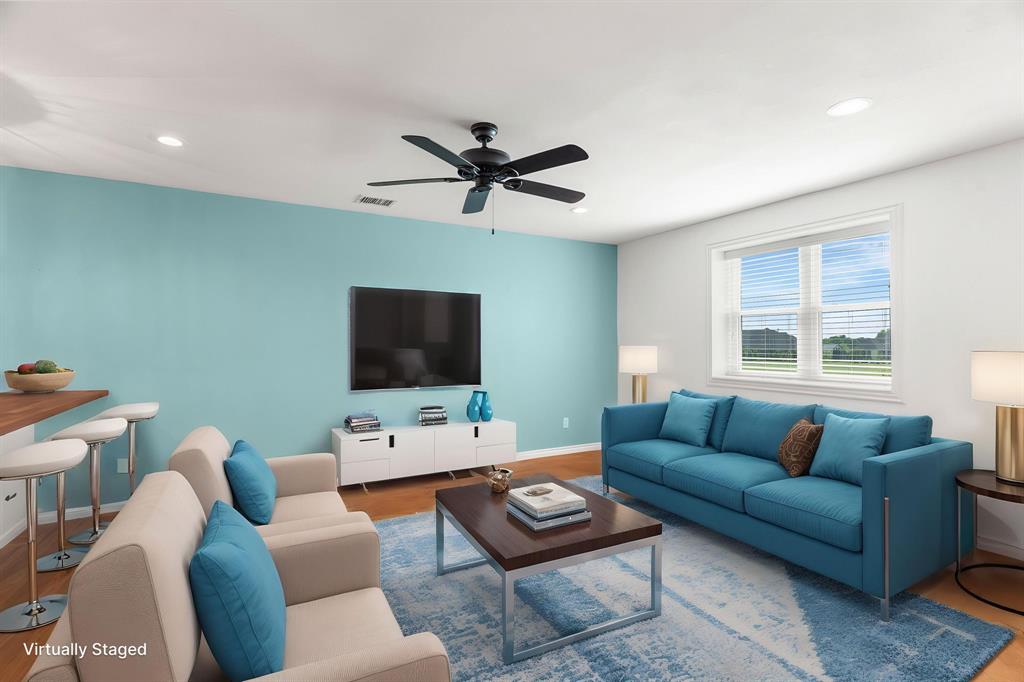 1206 Jc Maples Road Gunter, TX 75058 - Photo 35 of 40 a living room with furniture a flat screen tv and a window