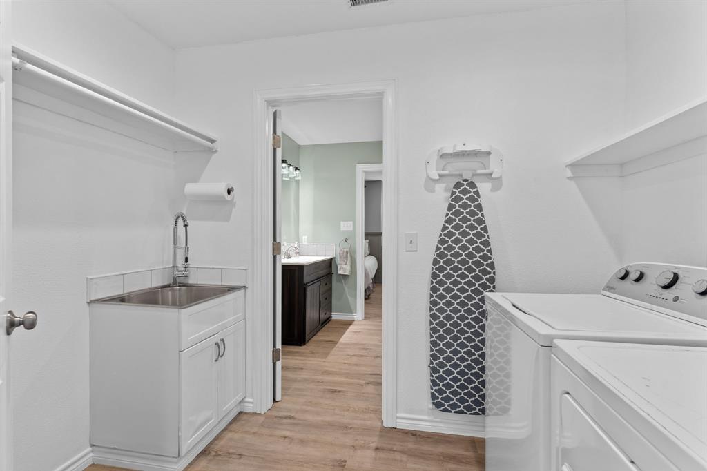1206 Jc Maples Road Gunter, TX 75058 - Photo 36 of 40 a bathroom with a sink and a mirror