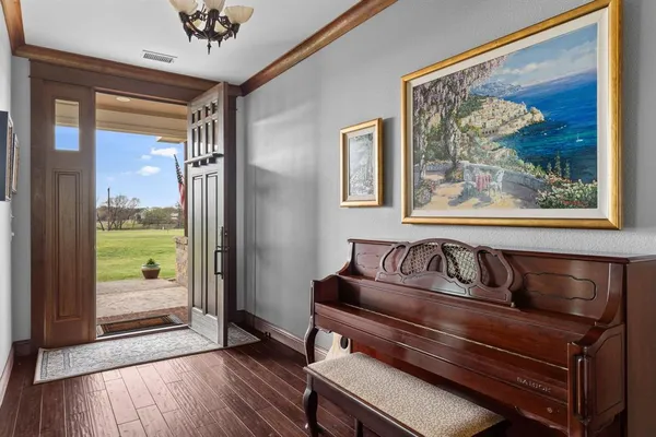a view of that has a painting on the wall and a large window