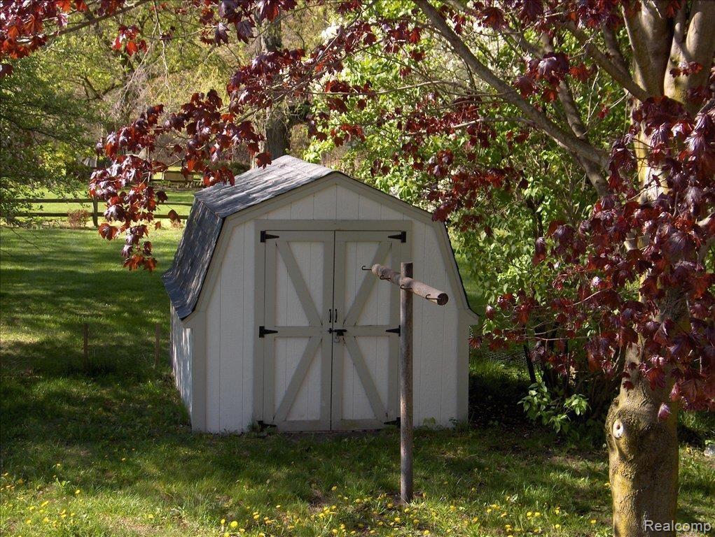 215 Riddle Street Howell, MI 48843 - Photo 4 of 6 Back Yard Shed