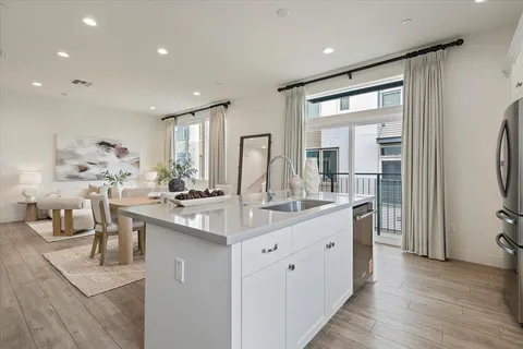 a kitchen with counter top space sink and refrigerator