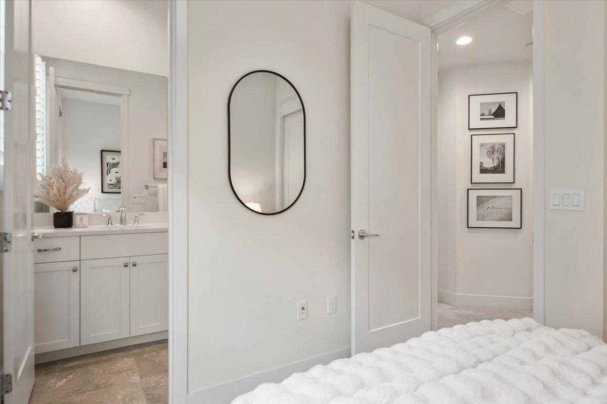 166 Nexus Loop San Jose, CA 95110 - Photo 15 of 29 a bedroom with a bed and a bathroom