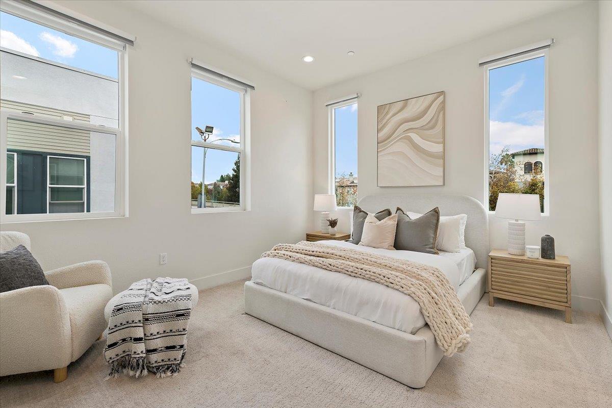 166 Nexus Loop San Jose, CA 95110 - Photo 17 of 29 a bedroom with a bed and a couch