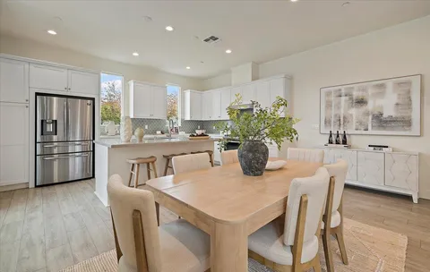 a kitchen with a table and chairs