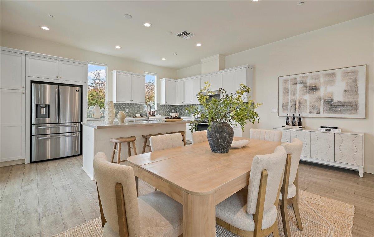 166 Nexus Loop San Jose, CA 95110 - Photo 8 of 29 a kitchen with a table and chairs