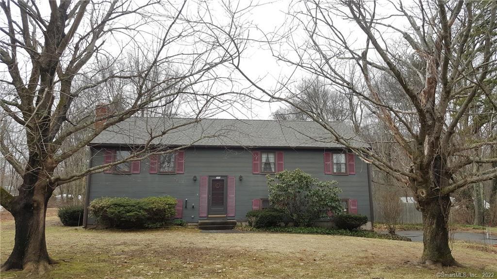 260 Cabin Road Colchester, CT 06415 - Photo 1 of 1 a front view of a house with yard and trees