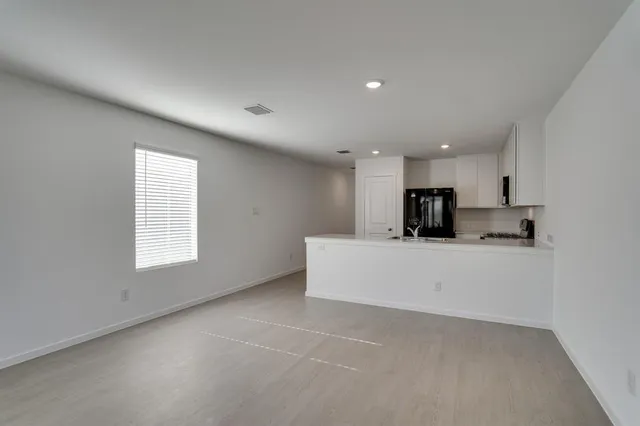 a view of kitchen with stainless steel appliances refrigerator oven a sink and dishwasher