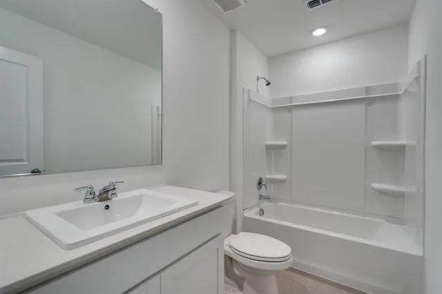 a bathroom with a sink a toilet and a bathtub