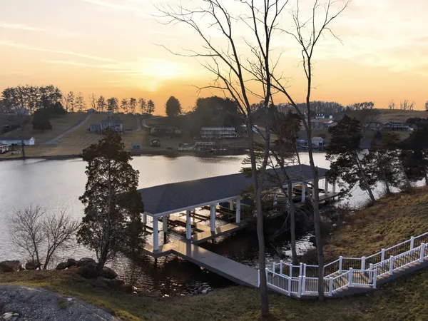 a spacious bathroom with a double vanity sink a mirror and a shower