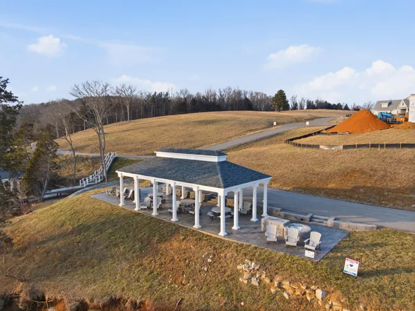 a white toilet sitting next to a bathroom sink and vanity