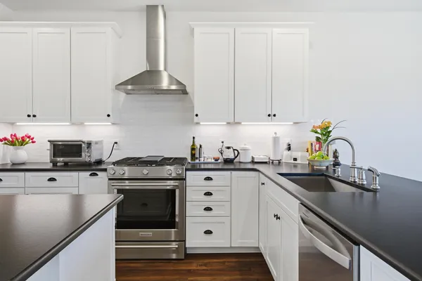 a white toilet sitting next to a small sink