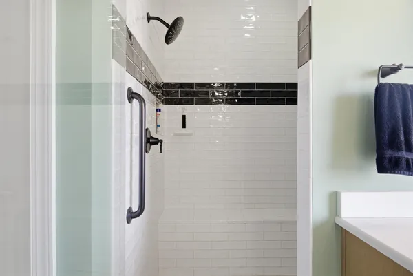 a bathroom with a toilet sink vanity and mirror