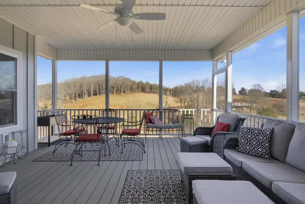 a view of a patio with table and chairs