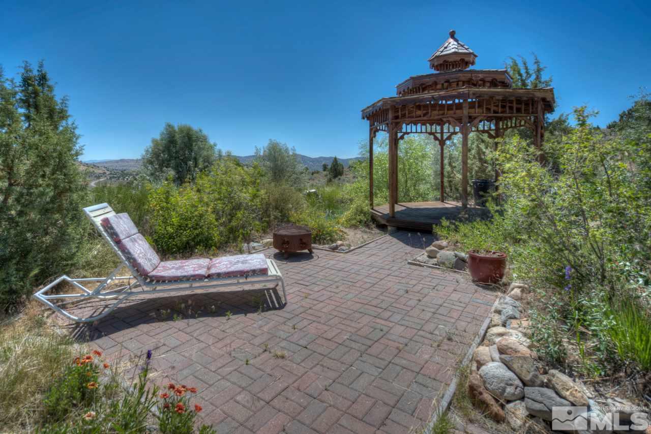 1215 Goldstone Road Reno, NV 89508 - Photo 17 of 23 a view of a chairs and table in the patio