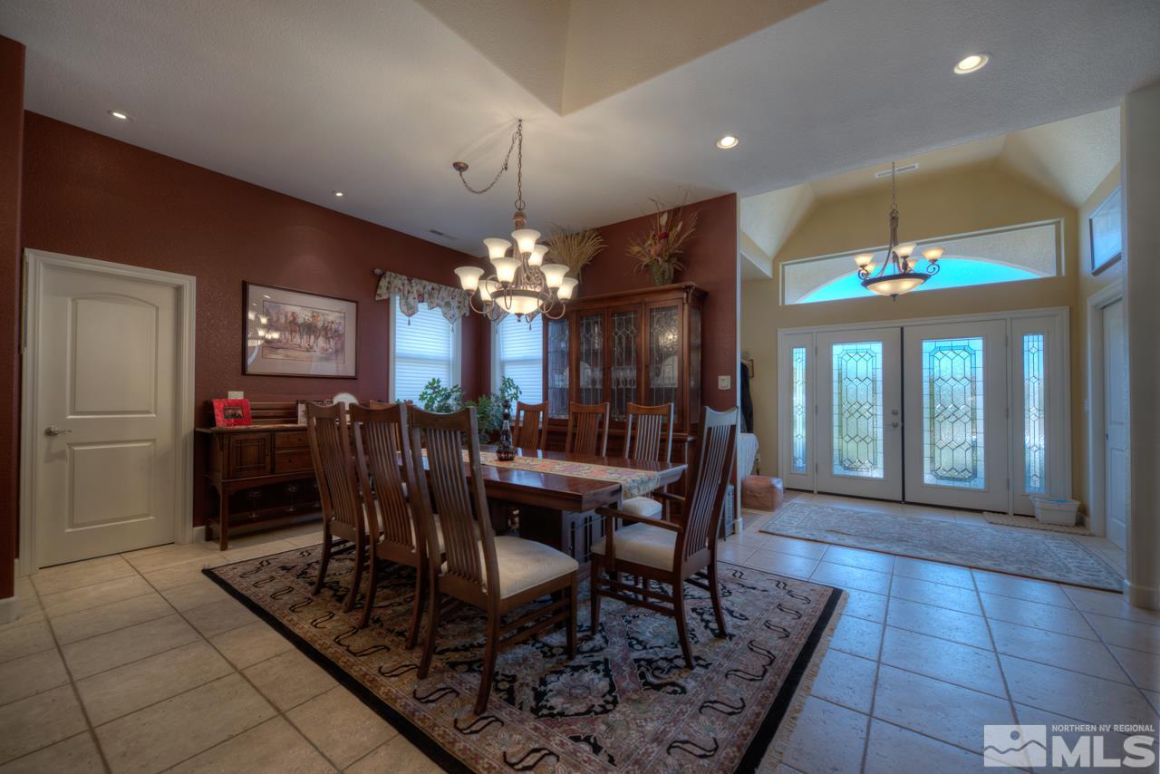 1215 Goldstone Road Reno, NV 89508 - Photo 6 of 23 a view of a dining room with furniture and chandelier