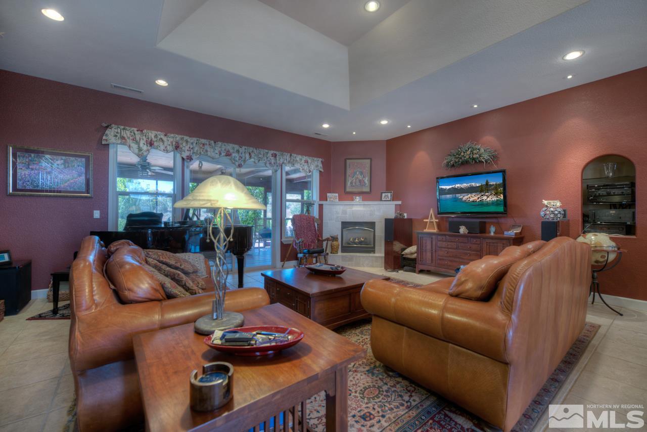 1215 Goldstone Road Reno, NV 89508 - Photo 10 of 23 a living room with fireplace furniture and a fireplace