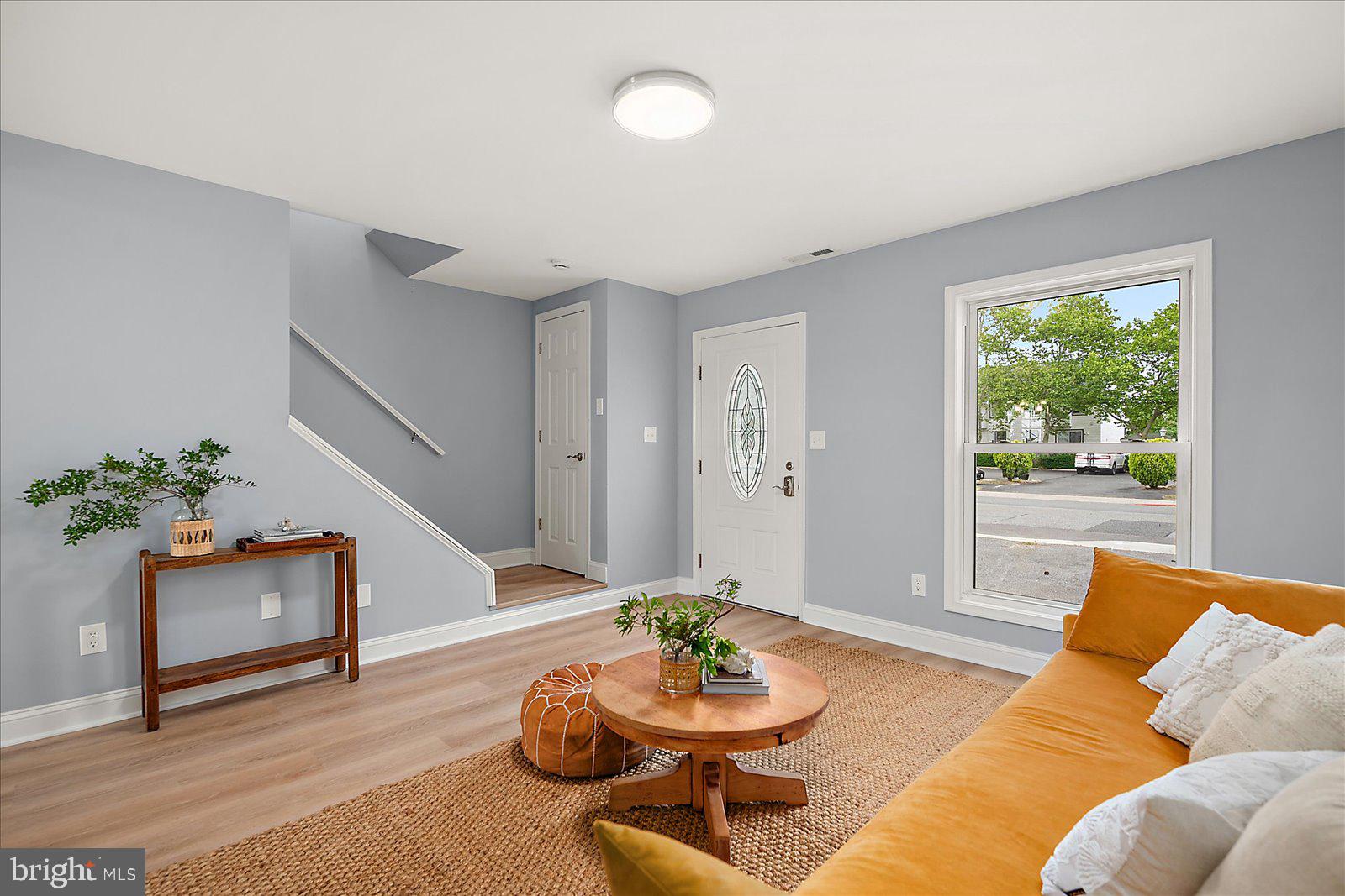135 Jamestown Road, Unit 18A Ocean City, MD 21842 - Photo 13 of 63 a living room with furniture and a potted plant