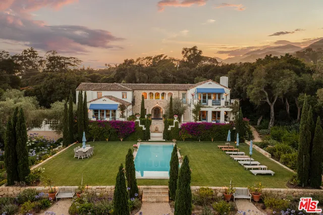 aerial view of a house with swimming pool garden and lake view