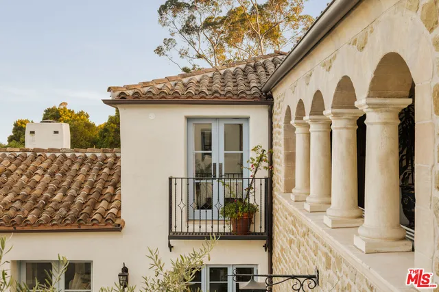 a front view of a house with large windows