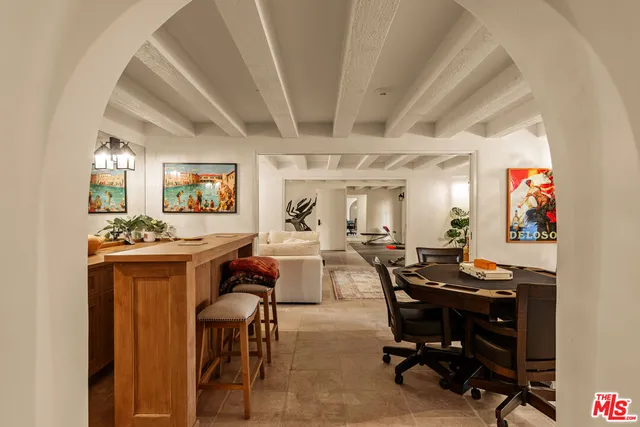 a view of a workspace with furniture and a kitchen